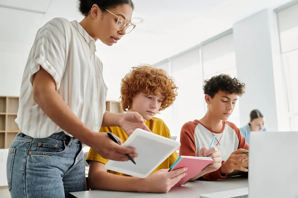 Students working with a learning coach